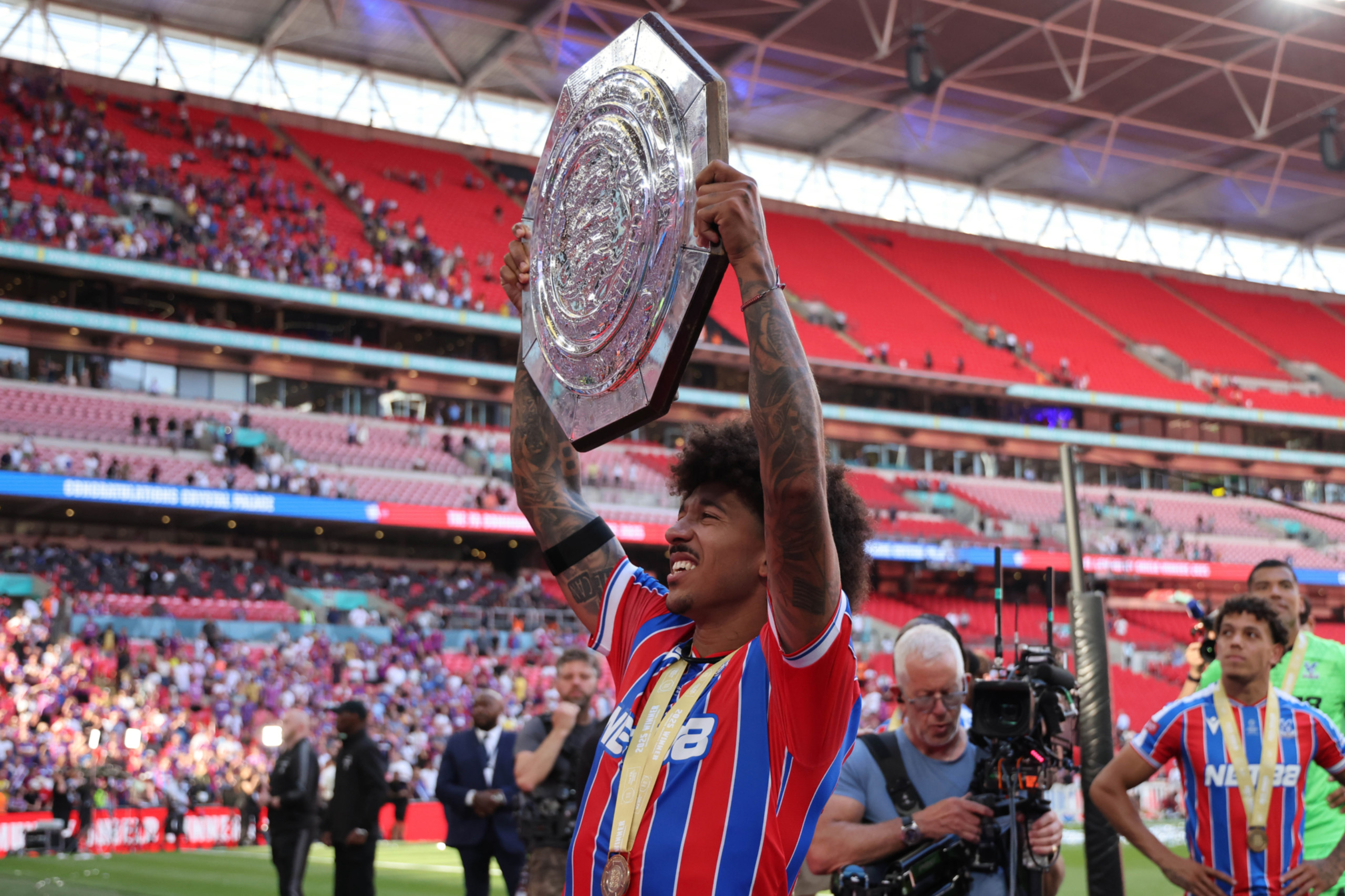 Crystal Palace defender Chris Richards holds the Community Shield.