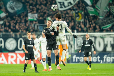 Gladbach player James Sands challenging for a header.