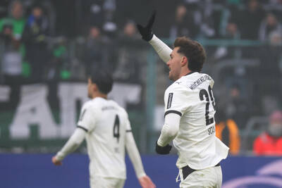 Joe Scally waving after scoring for Borussia Moenchengladbach.