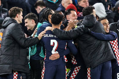 PSV celebrates at Liverpool in the Champions League.