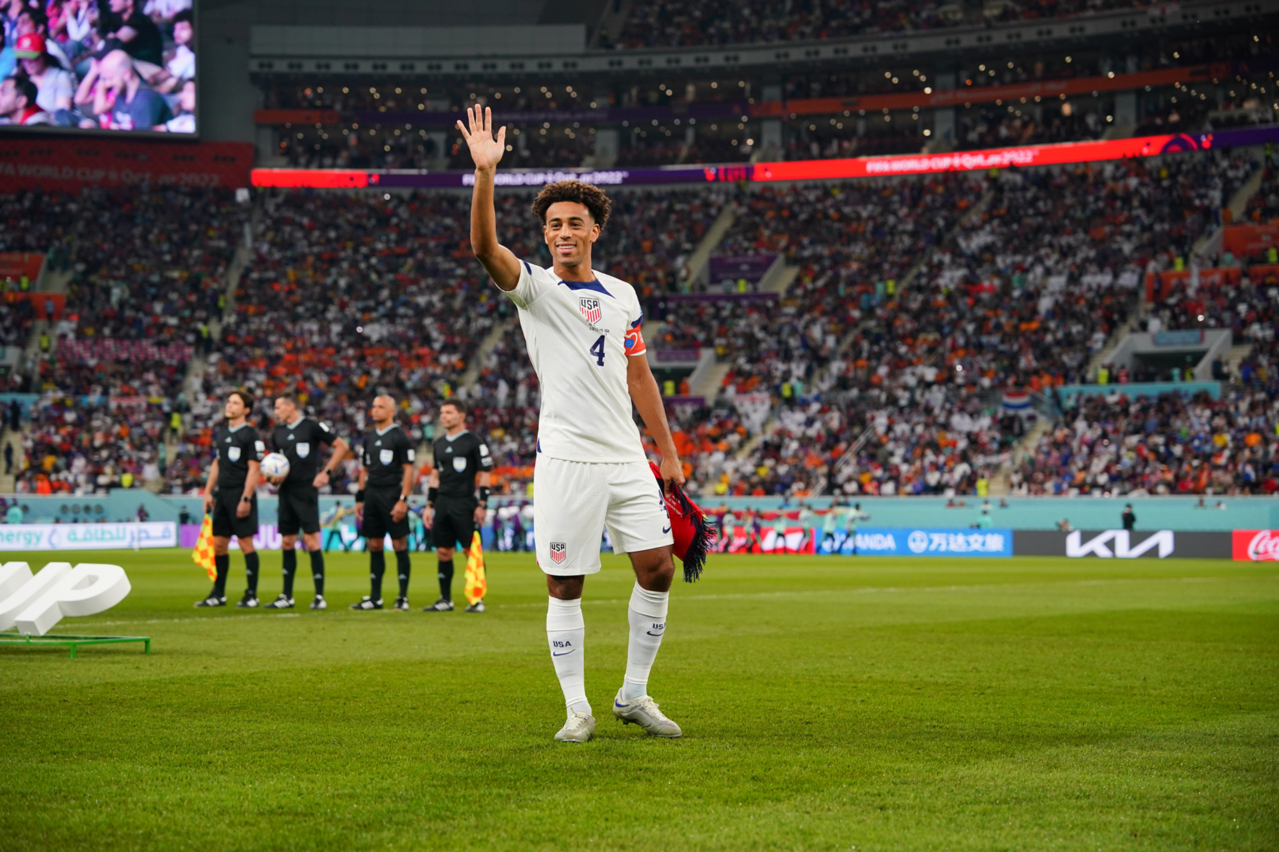 Tyler Adams waving to the crowd at the 2022 World Cup.