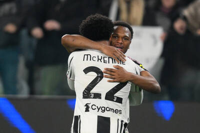 Weston McKennie hugging teammate Lois Openda to celebrate a goal.