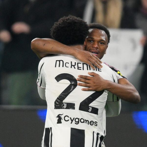Weston McKennie hugging teammate Lois Openda to celebrate a goal.